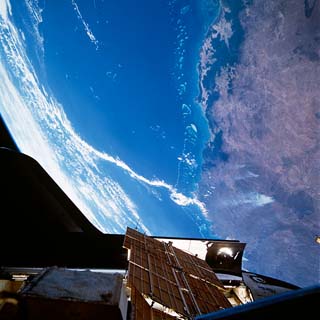 Docked Space Shuttle Atlantis and the Great Barrier Reef of Queensland, Australia. 